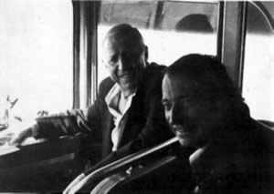 Stan Kenton and Francois Glorieux sitting in a tourbus.